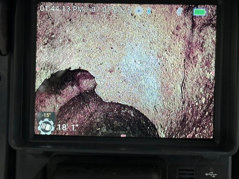 A closeup of a sewer line during a camera inspection.